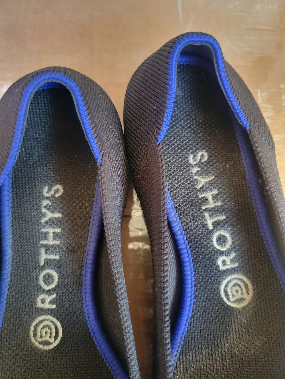 Rothy's Black Pointed Ballet Flat with Blue Trim